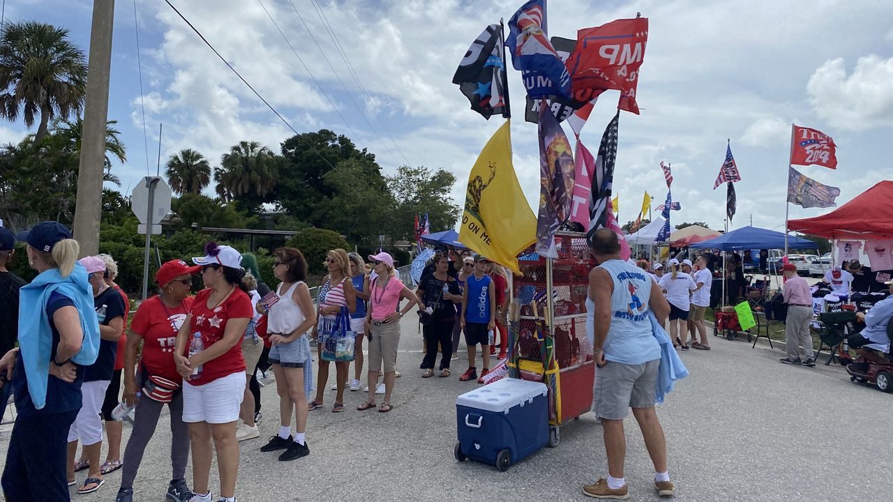 Vendors sell "Trump 2024" merchandise outside the former president's rally in Sarasota (Spectrum News/Laurie Davison)